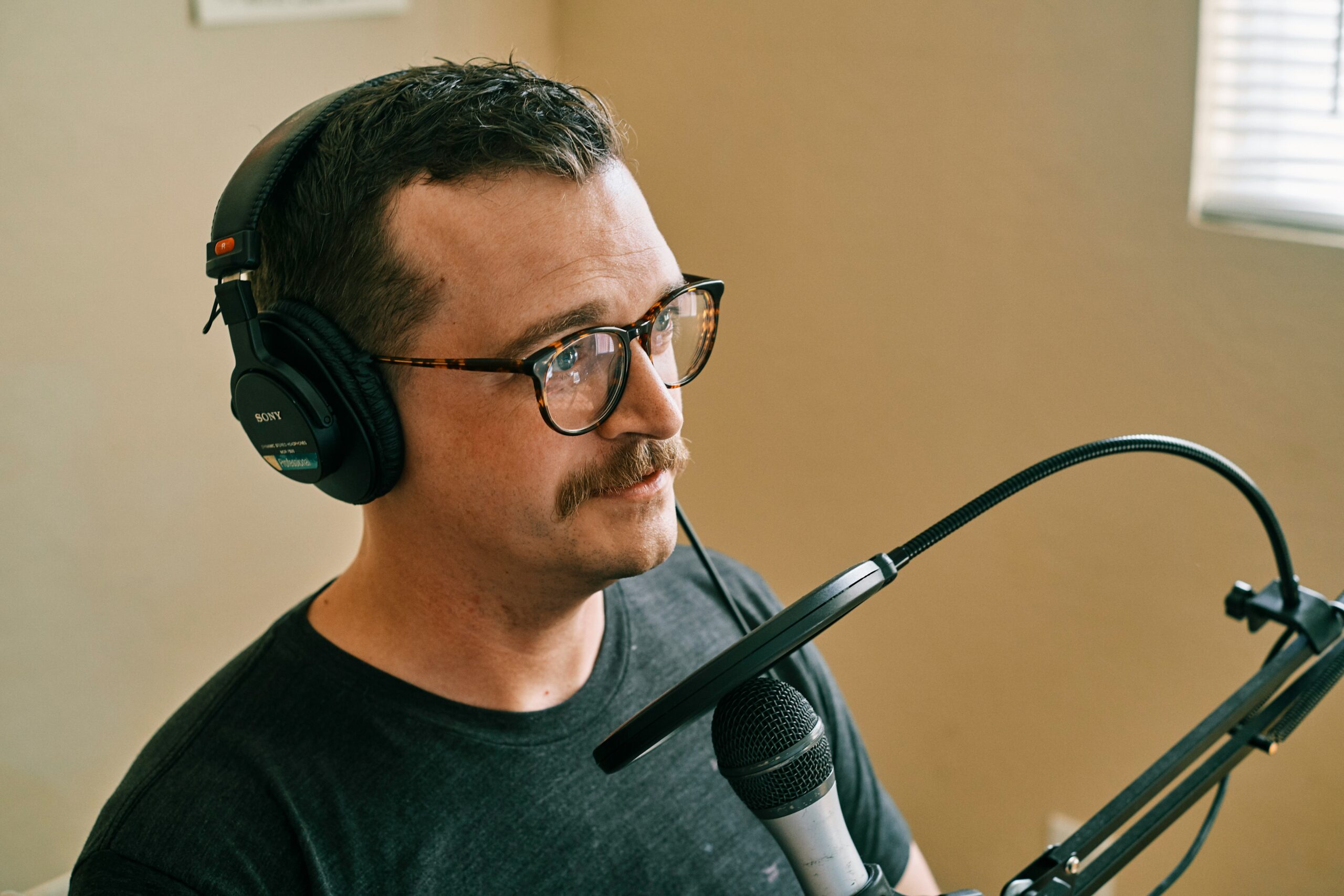 voice actor in front of a microphone